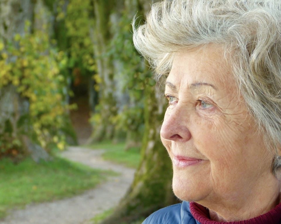 Portrait of an older woman outside